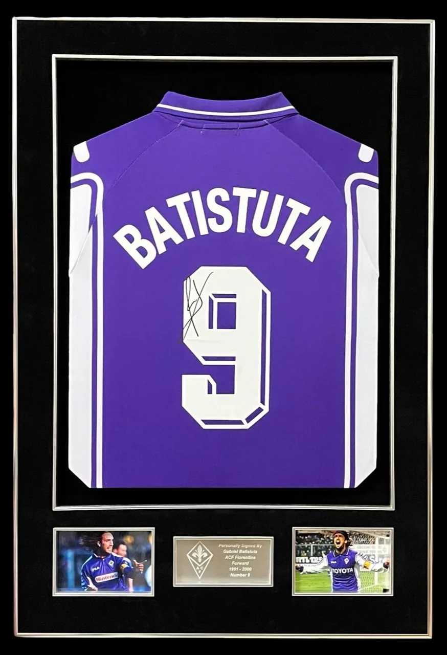 Gabriel Batistuta — signed Fiorentina shirt (plain purple, purple, gold frame) — authentic signed memorabilia, framed